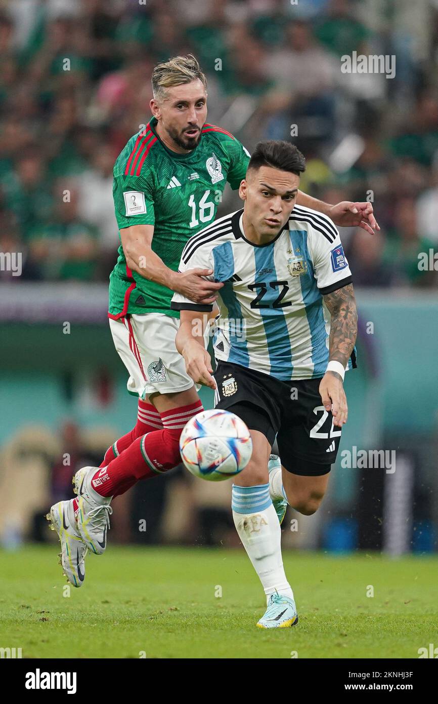 LUSAIL, QATAR - NOVEMBER 26: Player of Argentina Lautaro Martínez fights for the ball with player of Mexico Héctor Herrera during the FIFA World Cup Qatar 2022 group C match between Argentina and Mexico at Lusail Stadium on November 26, 2022 in Lusail, Qatar. (Photo by Florencia Tan Jun/PxImages) Stock Photo