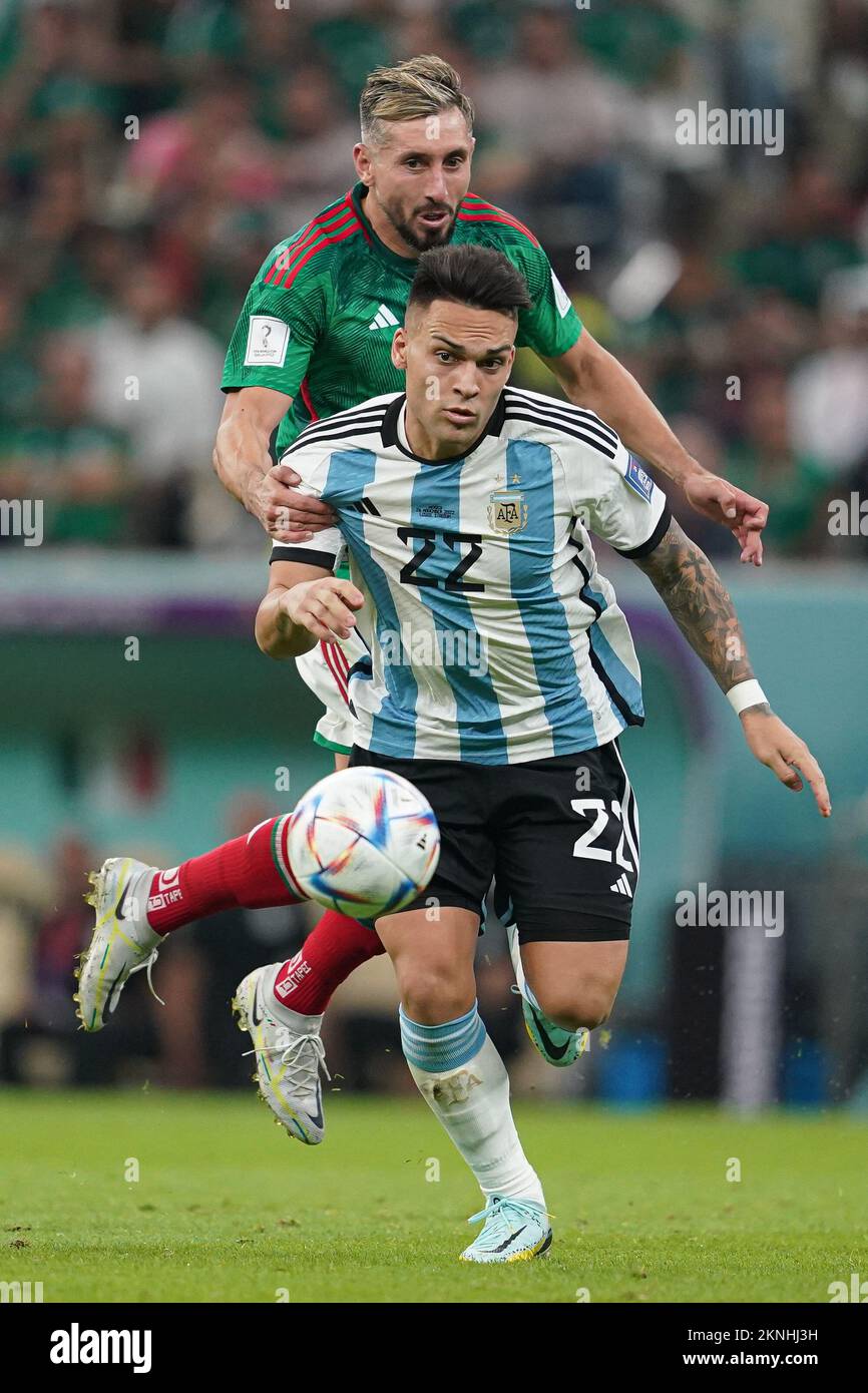 LUSAIL, QATAR - NOVEMBER 26: Player of Argentina Lautaro Martínez fights for the ball with player of Mexico Héctor Herrera during the FIFA World Cup Qatar 2022 group C match between Argentina and Mexico at Lusail Stadium on November 26, 2022 in Lusail, Qatar. (Photo by Florencia Tan Jun/PxImages) Stock Photo