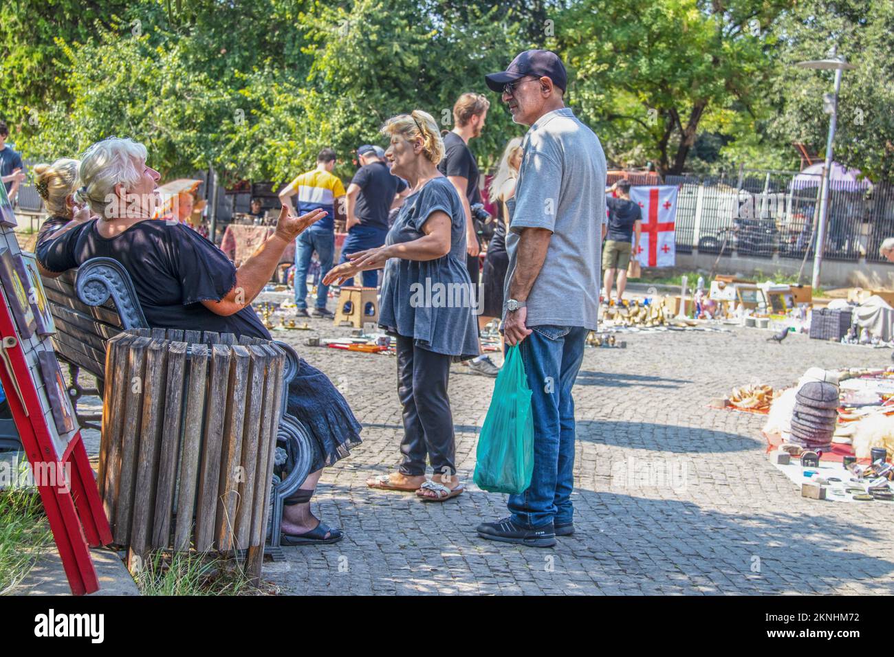 7-19-2019 - Tbilisi Georgia - Georgian women chatting in the shade on a bright sunny day at Dry Bridge flea Market in Tbilisi Stock Photo