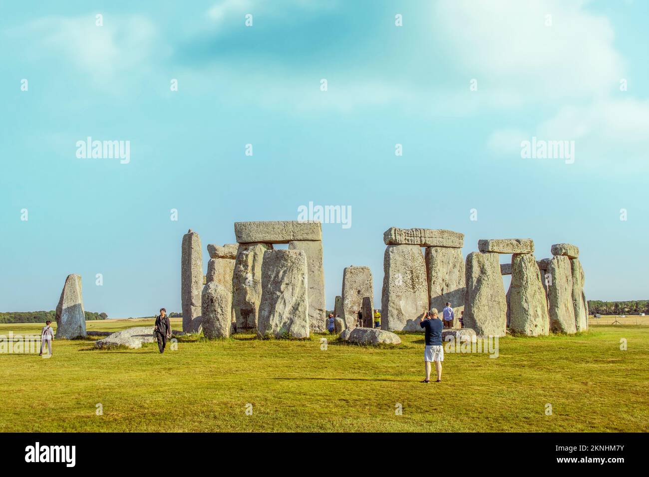 7-24-2019 Salisbury  UK - Tourists walking among the stones at Stonehenge taking pictures of a bright sunny day Stock Photo