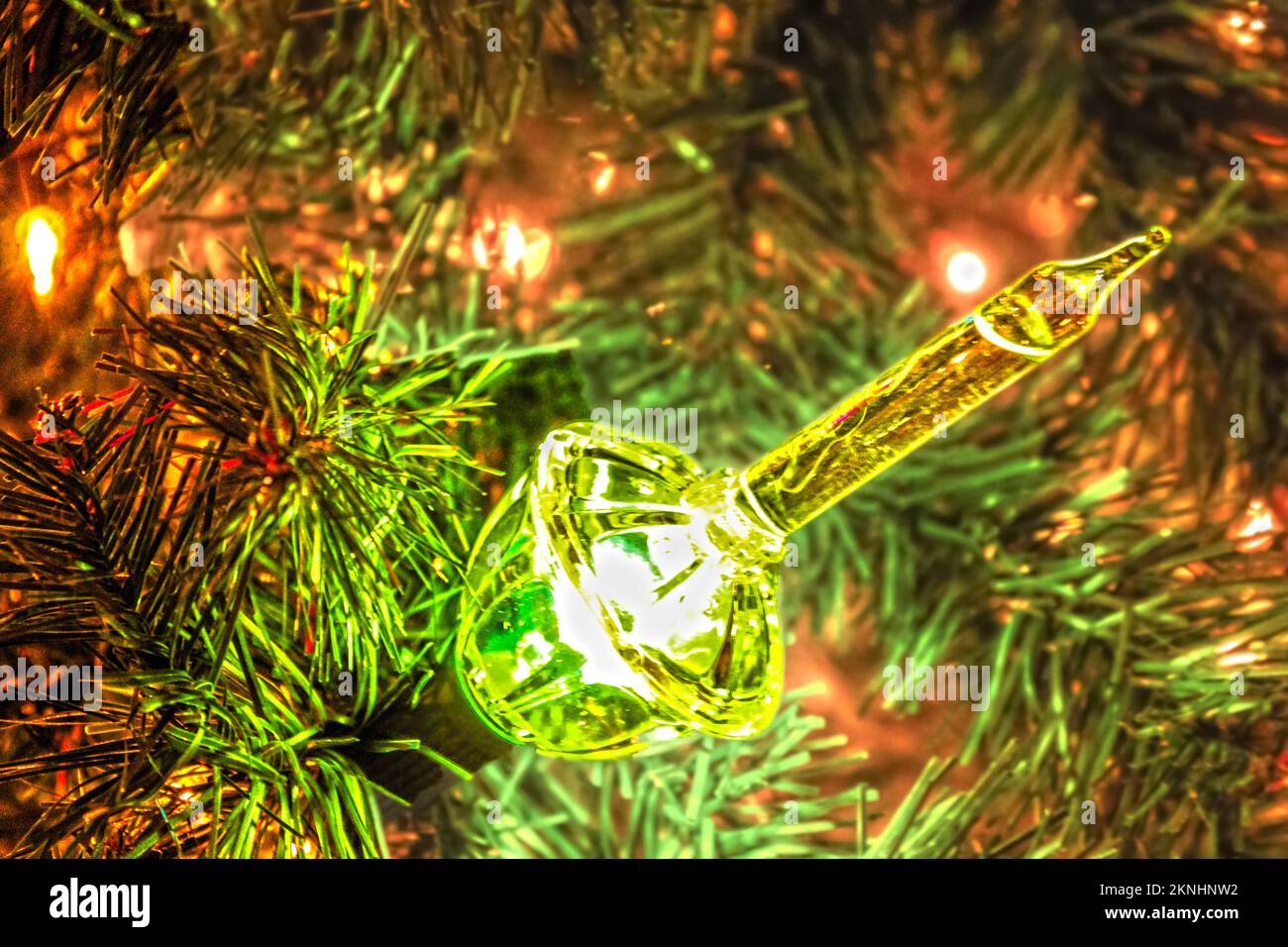 Green bubble light on Christmas tree background - room for copy. Stock Photo