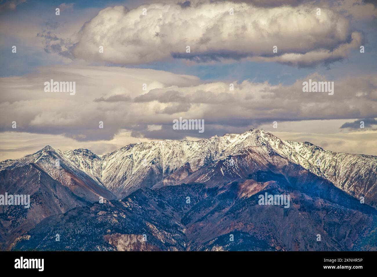 Puple mountains - majestic Sierra Nevanda range of eastern California  USA with snow-topped peaks under dramatic sky. Stock Photo