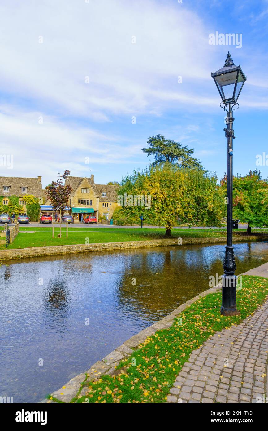 BourtonontheWater, UK October 17, 2022 Scene of typical houses, the river Windrush, locals