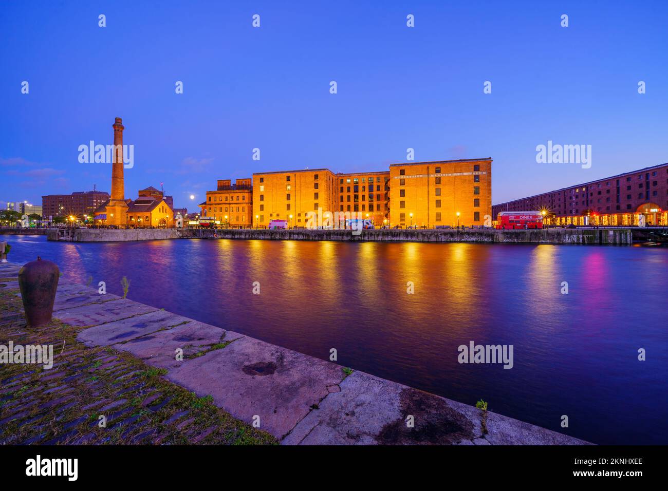 Liverpool, UK - October 07, 2022: Evening view of the Royal Albert Dock, with the moon, in Liverpool, Merseyside, England, UK Stock Photo