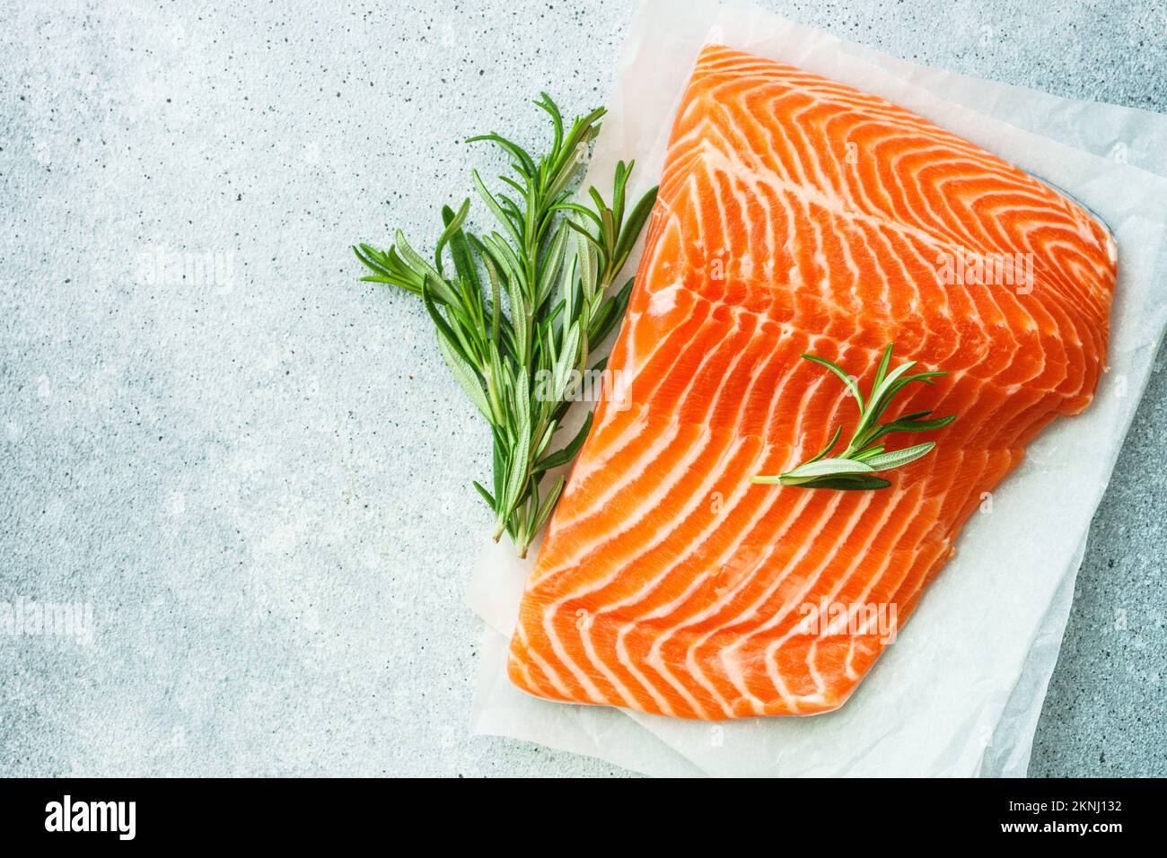 Raw salmon, fresh fish fillet at white background Stock Photo - Alamy