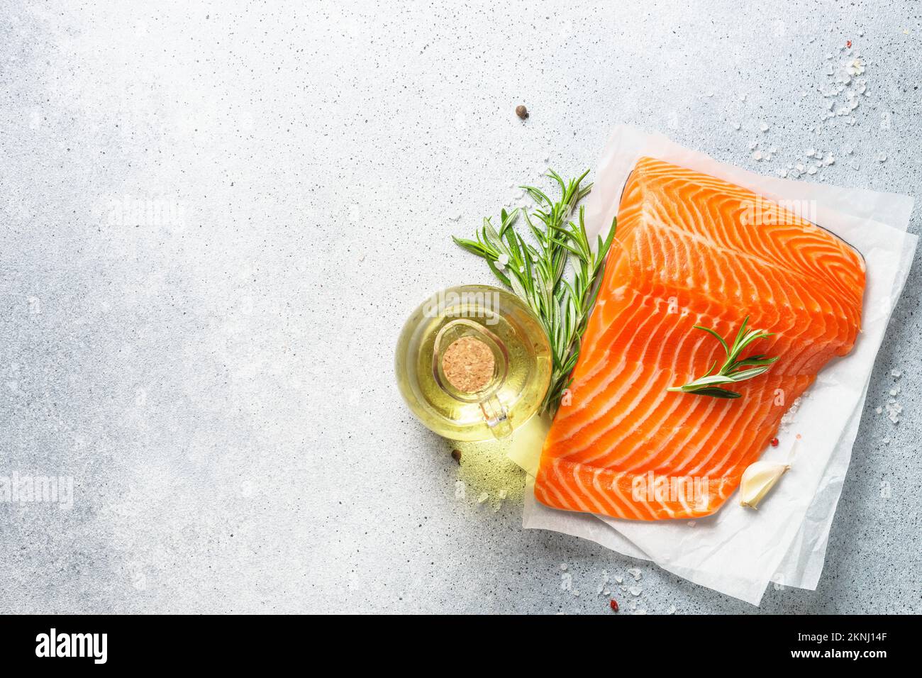 Raw salmon, fresh fish fillet at black background Stock Photo - Alamy