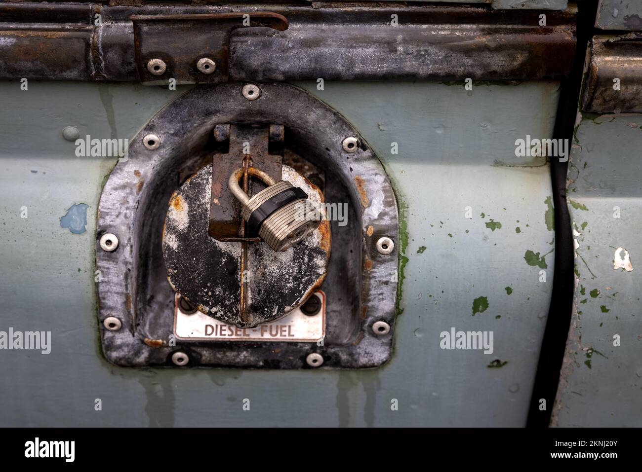 1972 Land Rover fuel cap with a padlock Stock Photo - Alamy