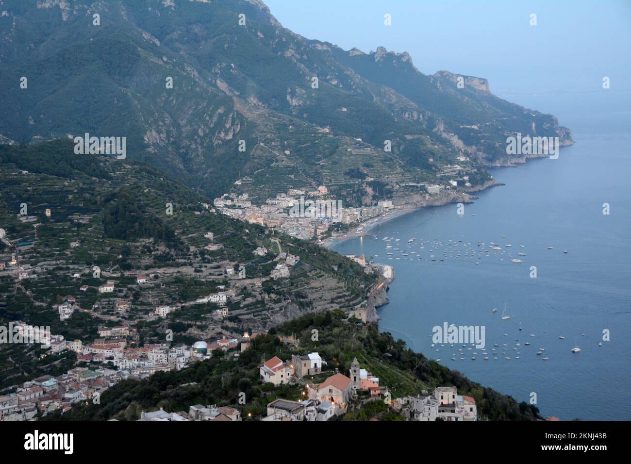 A view at dusk of the scenic Amalfi Coast from Ravello looking towards the coastal beach towns of Minori and Maori, in Campania, southern Italy. Stock Photo