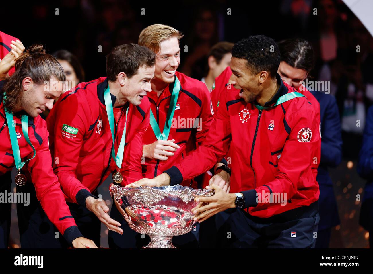 Vasek Pospisil, Denis Shapovalov and Felix Auger-Aliassime of Canada celebrate the victory with the trophy after winning the Davis Cup Finals 2022, Final, against Australia on november 27, 2022 at Palacio de Deportes Martin Carpena pavilion in Malaga, Spain - Photo: Oscar J Barroso/DPPI/LiveMedia Stock Photo