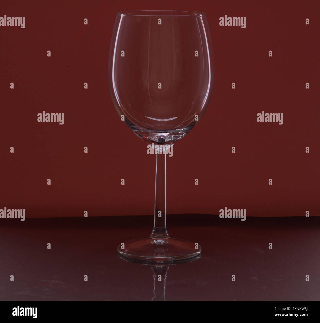 https://c8.alamy.com/comp/2KNKW3J/photo-of-an-empty-wine-glass-on-a-pink-background-2KNKW3J.jpg