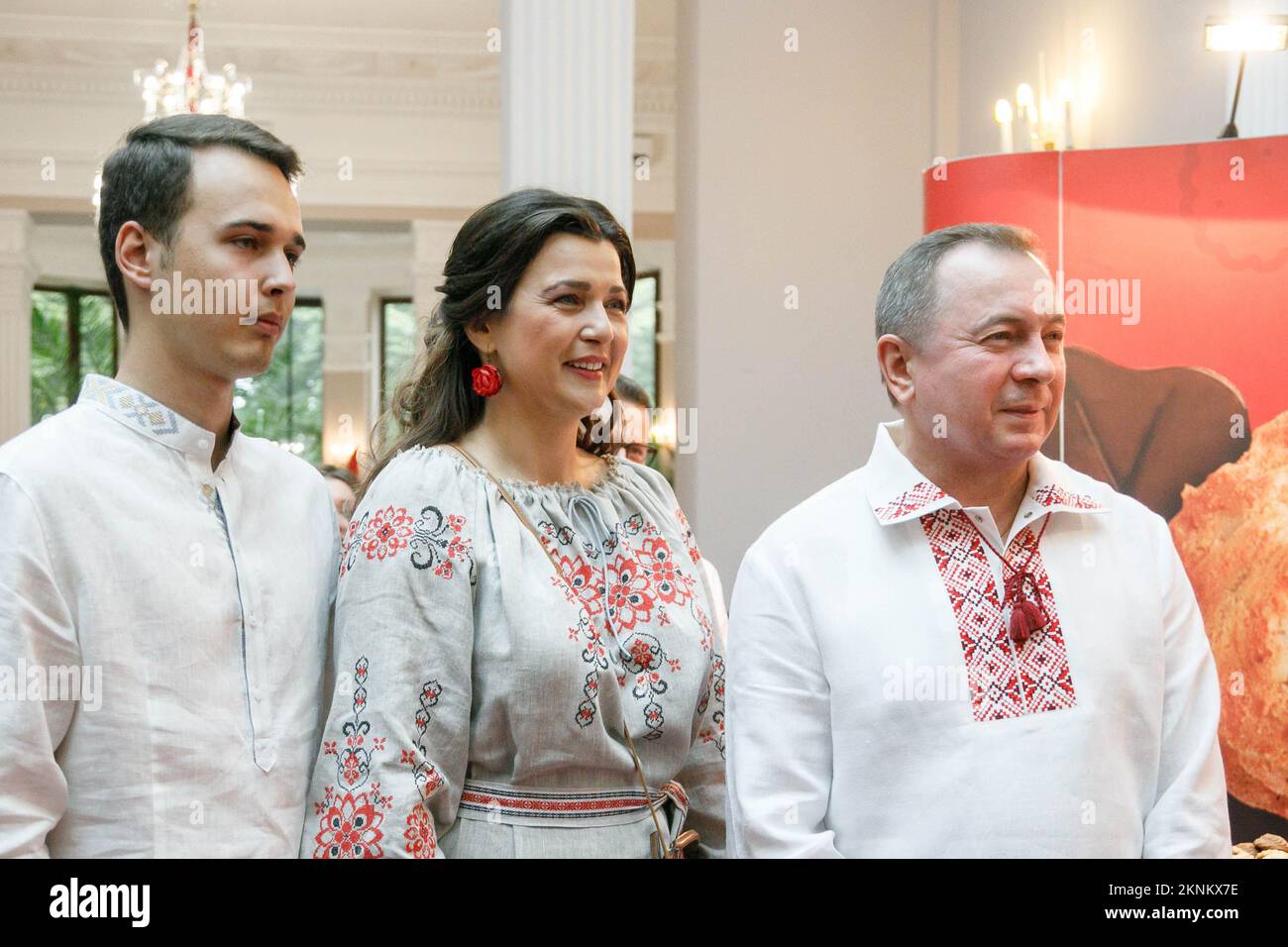 The Minister of Foreign Affairs of the Republic of Belarus Vladimir Makei (or Uladzimir Makiej) wearing vyshyvanka, a traditional Belarusian embroidered shirt smiles near her wife, actress Vera Paljakova-Makej and her son during the event called In Belarus Like At Home, organized by his Ministry for foreign diplomats. Vladimir Vladimirovich Makei (or Uladzimir Makiej) died in Minsk on November 26, 2022. He was 64 years old. There is no information that he had a chronic illness. Belarusian authorities did not state his cause of death. Makei served as the Minister of Foreign Affairs of Belarus f Stock Photo