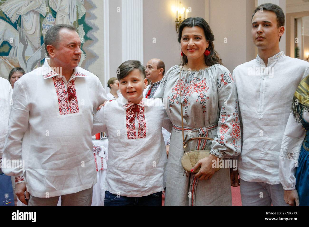 The Minister of Foreign Affairs of the Republic of Belarus Vladimir Makei (or Uladzimir Makiej) wearing vyshyvanka, a traditional Belarusian embroidered shirt smiles near her wife, actress Vera Paljakova-Makej and her son, and their common youngest son during the event called In Belarus Like At Home, organized by his Ministry for foreign diplomats. Vladimir Vladimirovich Makei (or Uladzimir Makiej) died in Minsk on November 26, 2022. He was 64 years old. There is no information that he had a chronic illness. Belarusian authorities did not state his cause of death. Makei served as the Minister Stock Photo