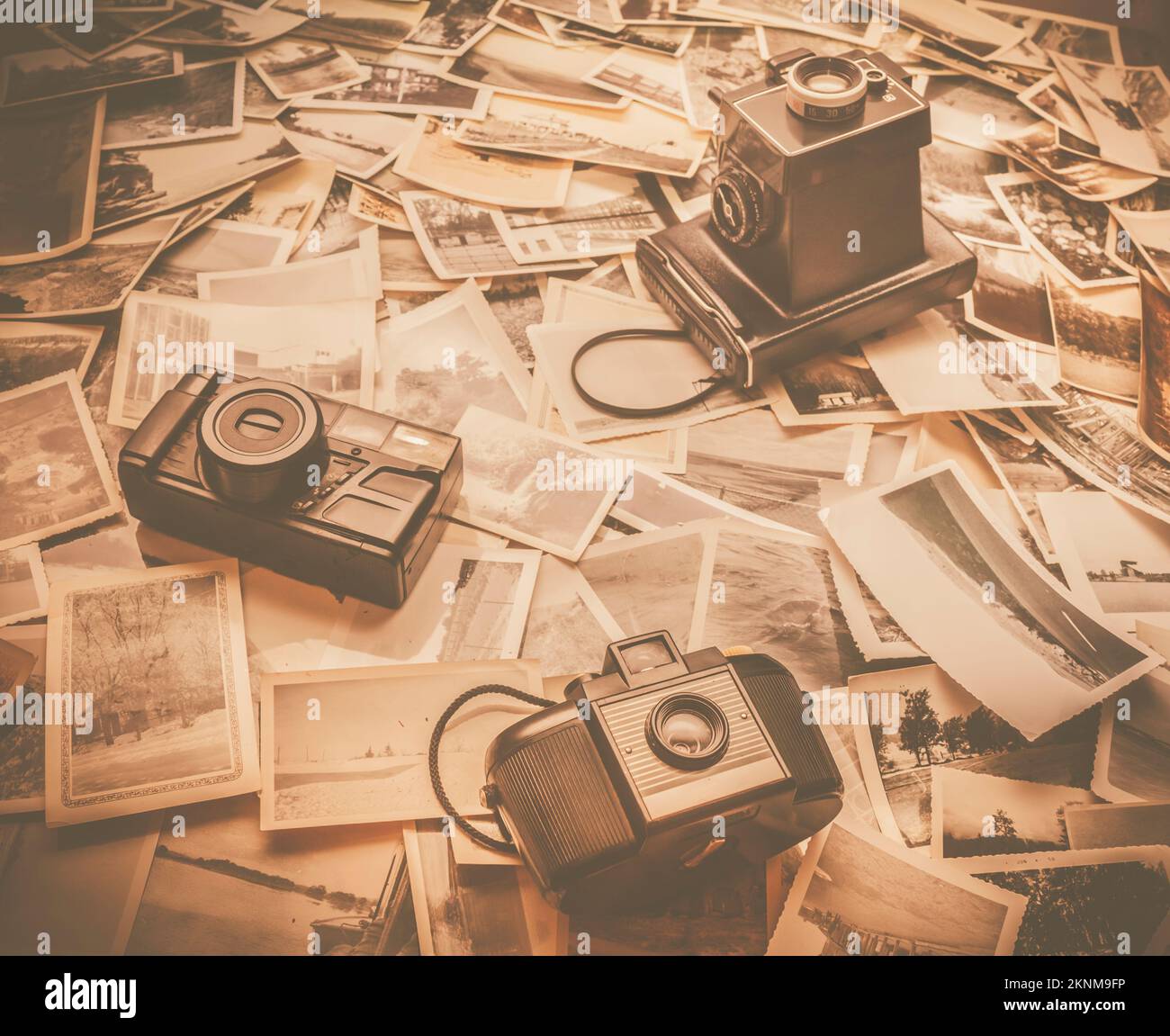 Three retro film cameras overlaid on a historic collection of time