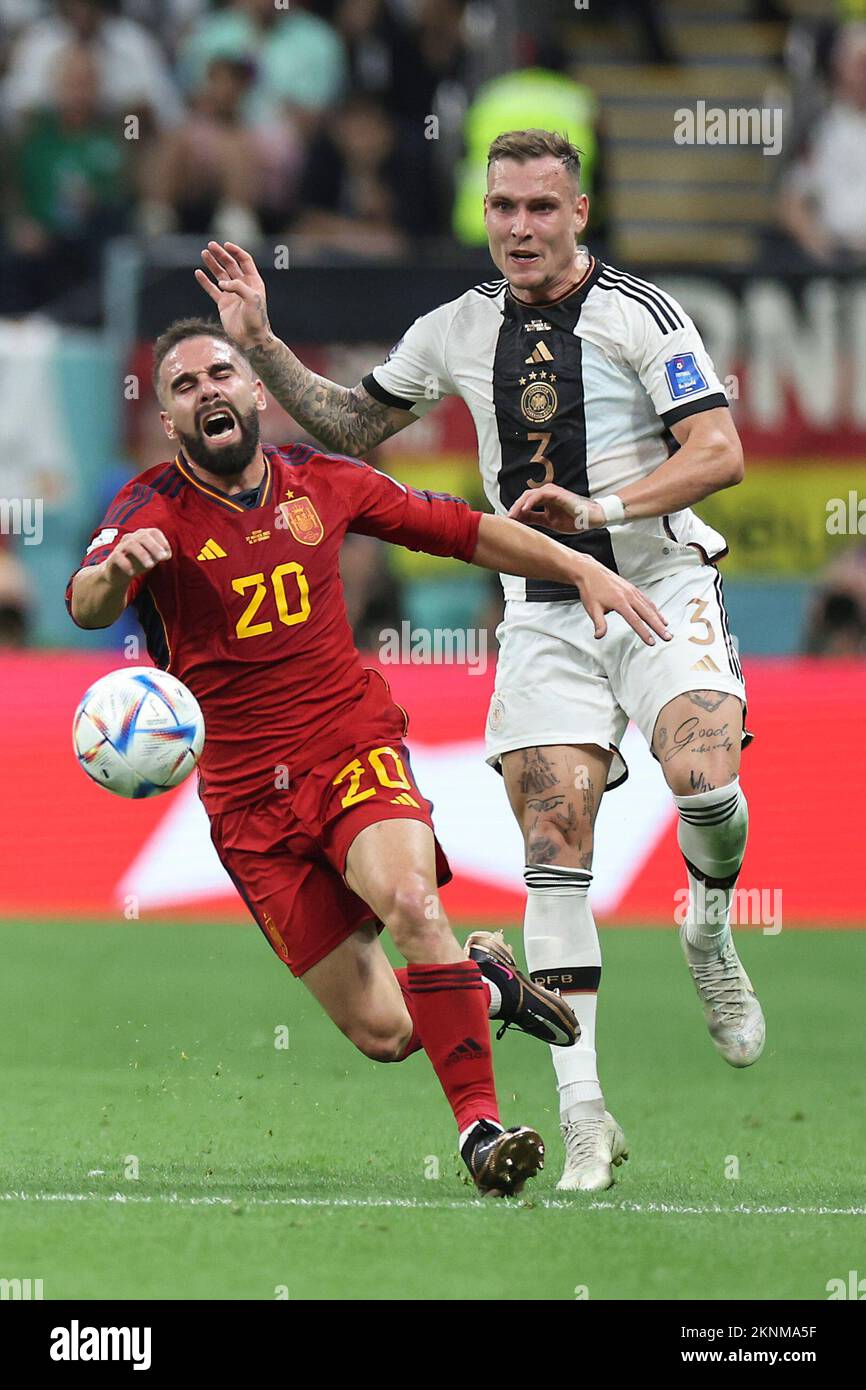 Al Khor, Qatar. 27th Nov, 2022. Dani Carvajal (L) of Spain vies with David Raum of Germany during the Group E match between Spain and Germany at the 2022 FIFA World Cup at Al Bayt Stadium in Al Khor, Qatar, Nov. 27, 2022. Credit: Cao Can/Xinhua/Alamy Live News Stock Photo