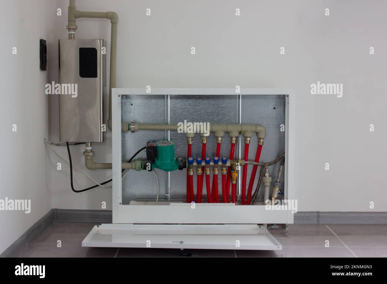 Electric boiler and manifold taps. Heating the house with a warm floor