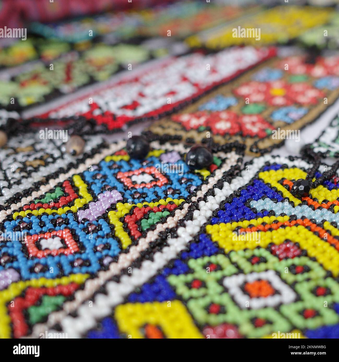 Native Amazonian weavings and textile designs on sale in a market in Iquitos, Peru Stock Photo