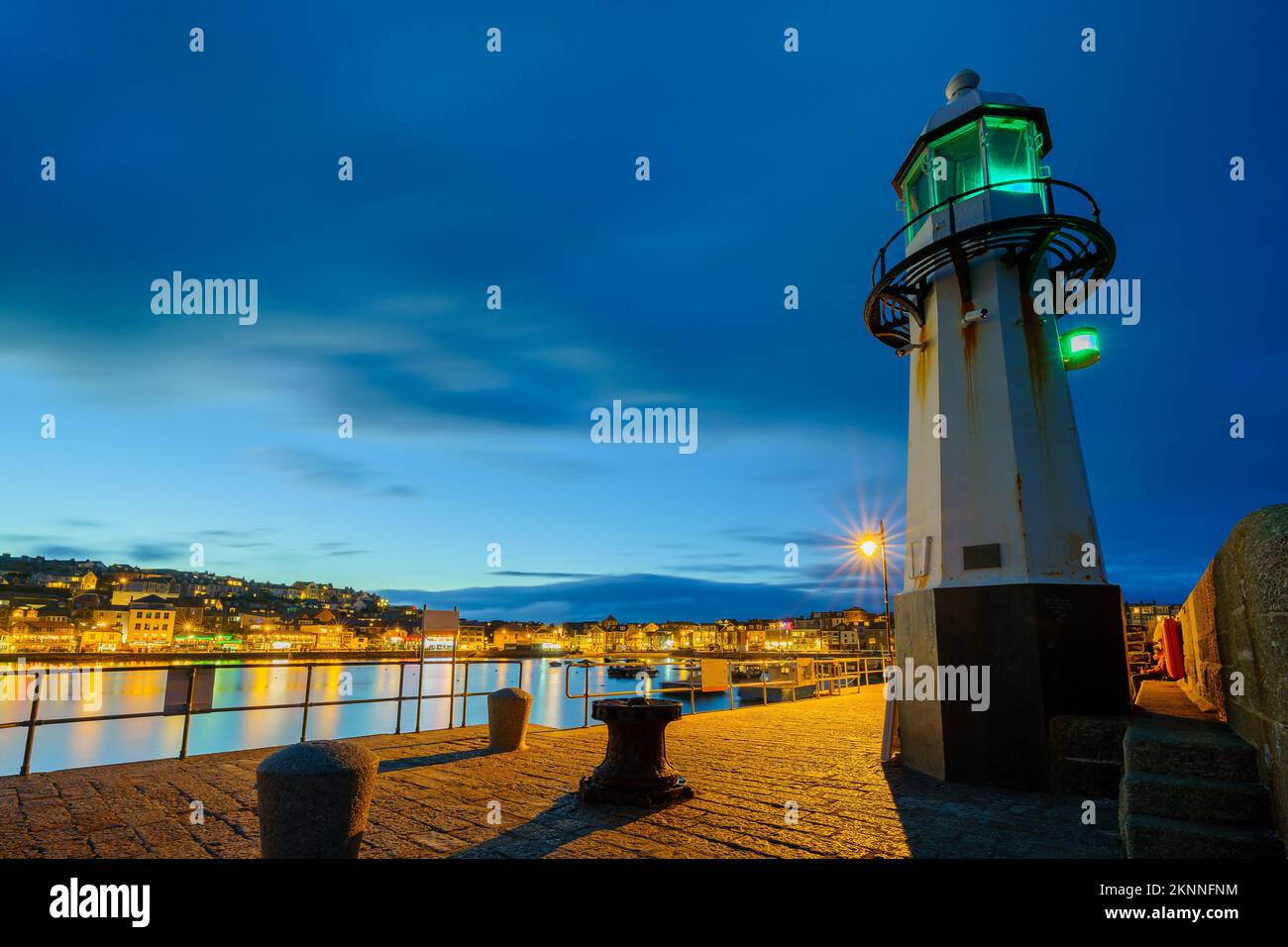 Evening view of the lighthouse and harbor, in St Ives, Cornwall, England, UK Stock Photo