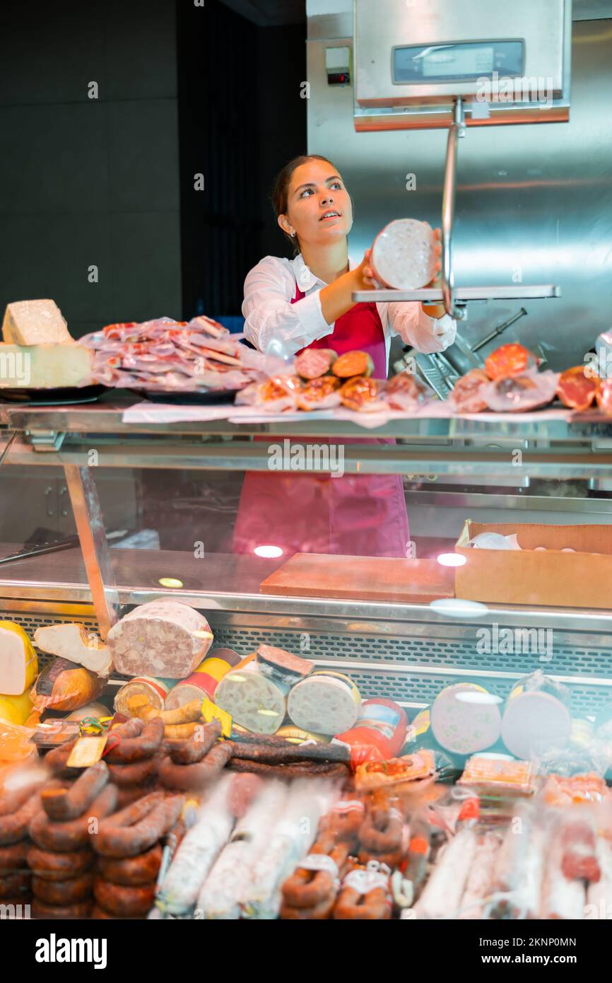 Butcher weighing meat on scale hi-res stock photography and images - Alamy