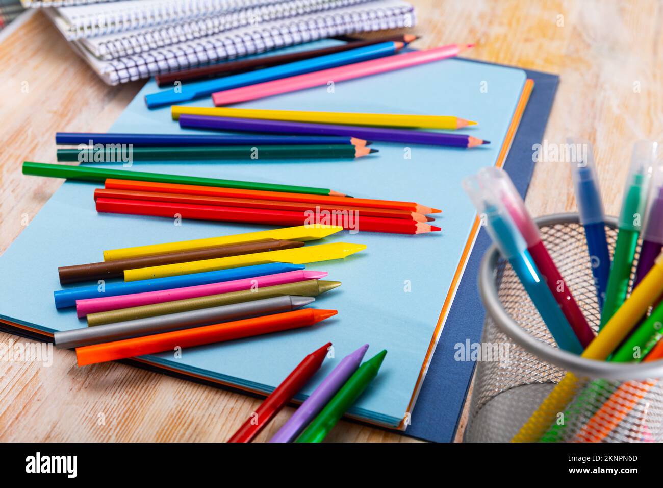 Colored pencils kept in pencil holder Stock Photo
