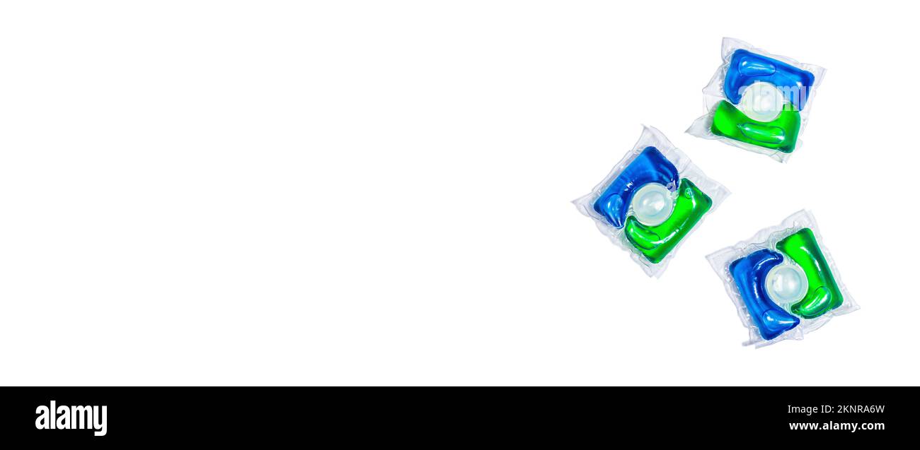 Capsules with detergent for washing machine isolated on white