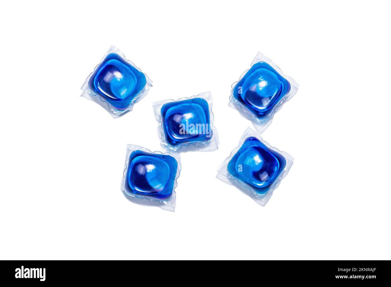 Capsules with detergent for washing machine isolated on white