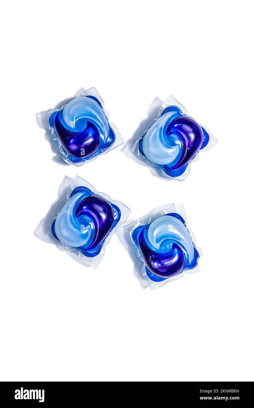 Capsules with detergent for washing machine isolated on white