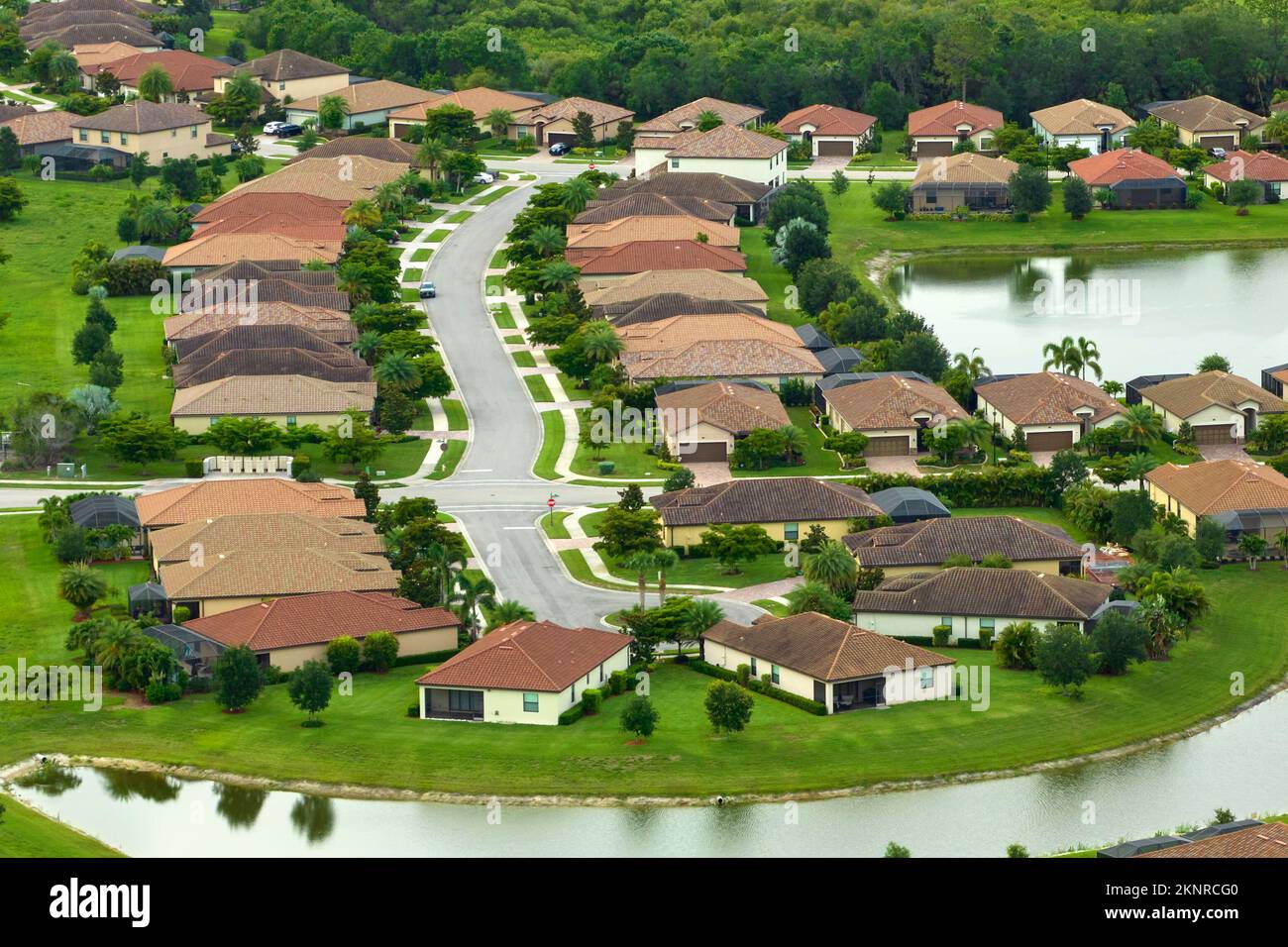 Aerial view of tightly located family houses in Florida closed suburban