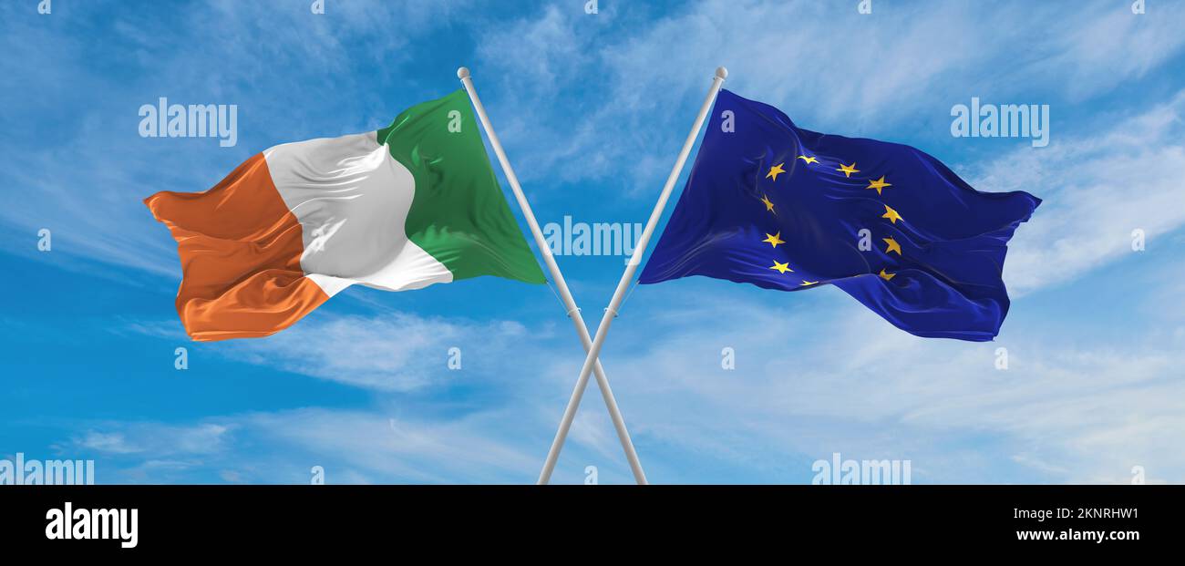 two crossed flags The European Union and Ireland waving in wind at ...