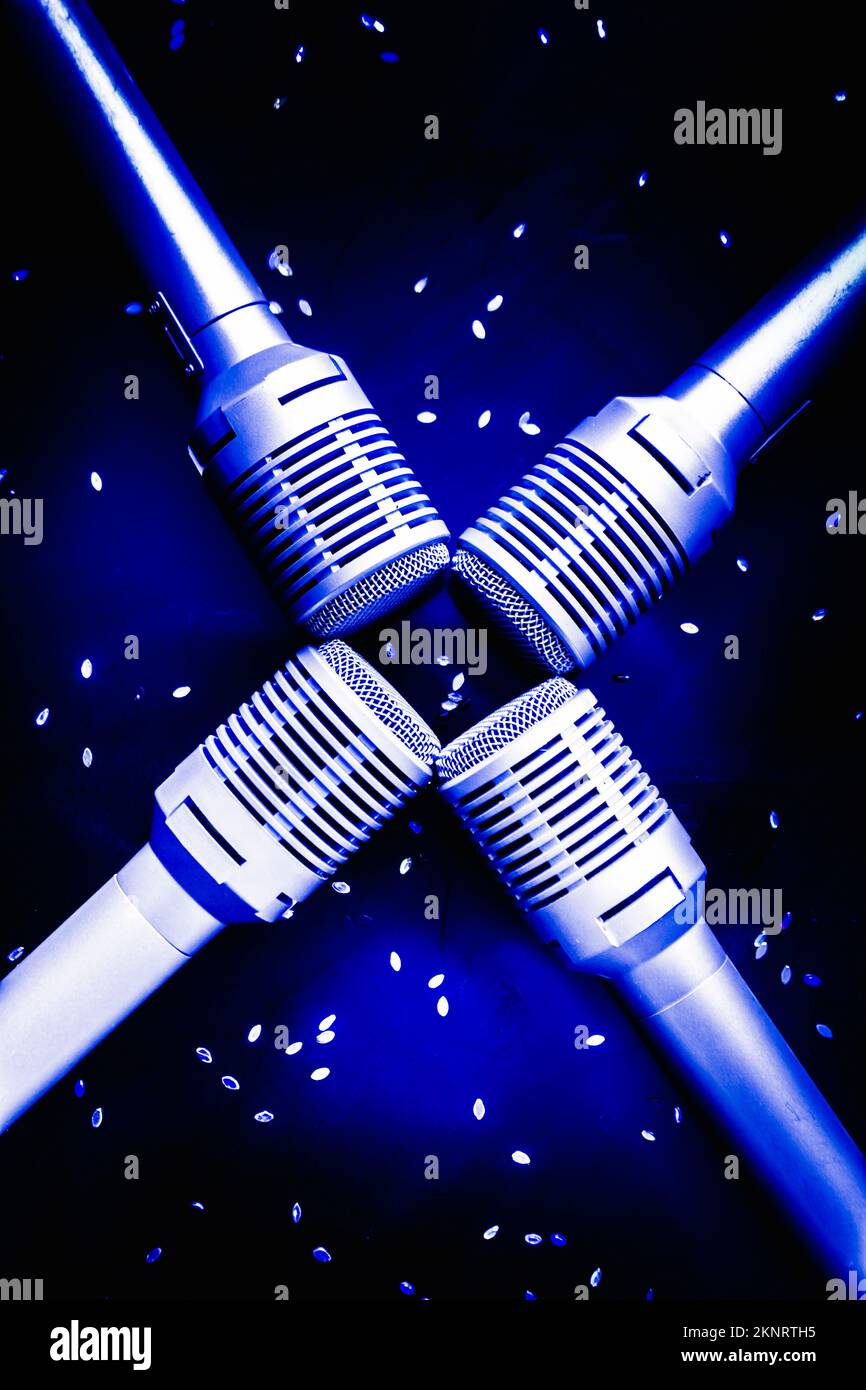 Four expensive microphones for musical performance and events, dark