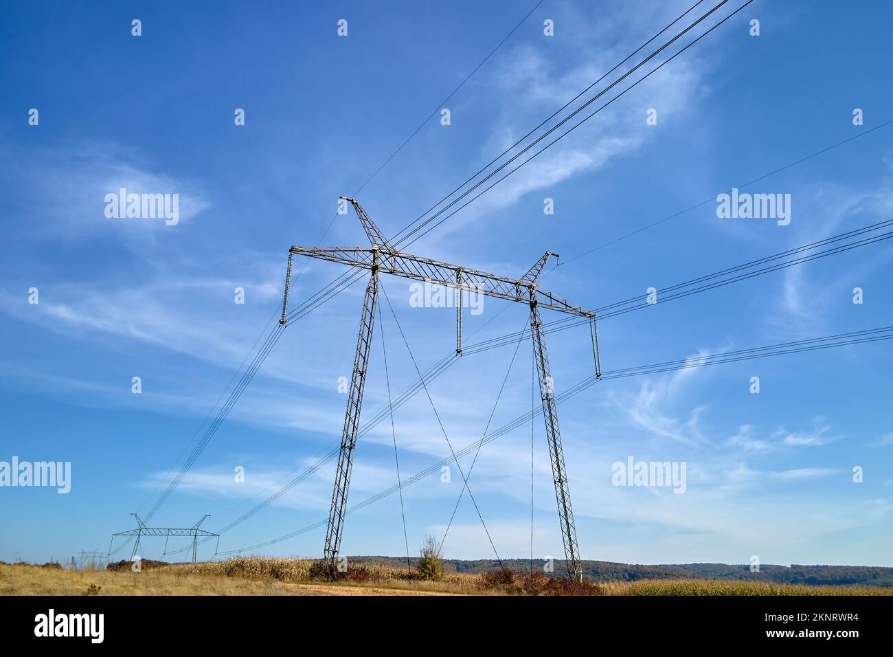 High voltage tower with electric power lines transfening electrical ...