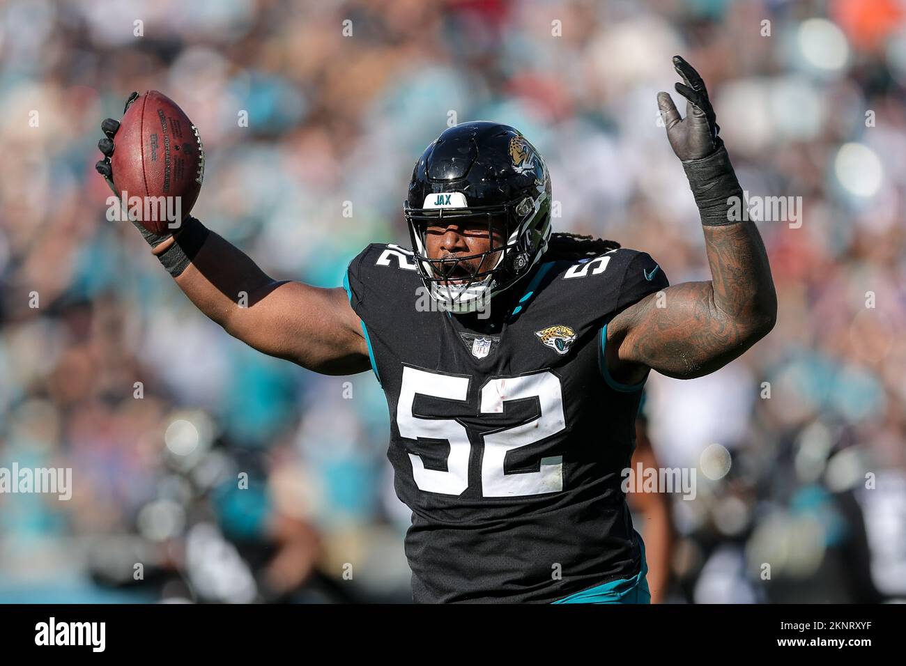 Jacksonville, Florida, USA. November 27, 2022: Jacksonville Jaguars  defensive tackle DAVON HAMILTON (52) celebrates after a turn over during  the Jacksonville Jaguars vs Baltimore Ravens NFL game at TIAA Bank Field  Stadium