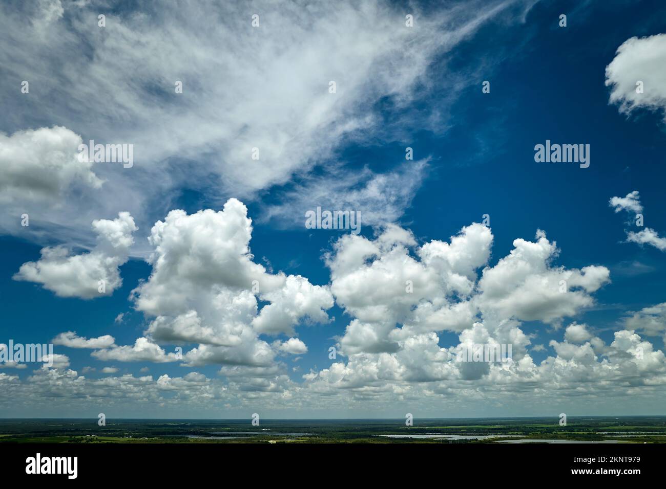 White puffy cumulus clouds on summer blue sky Stock Photo - Alamy