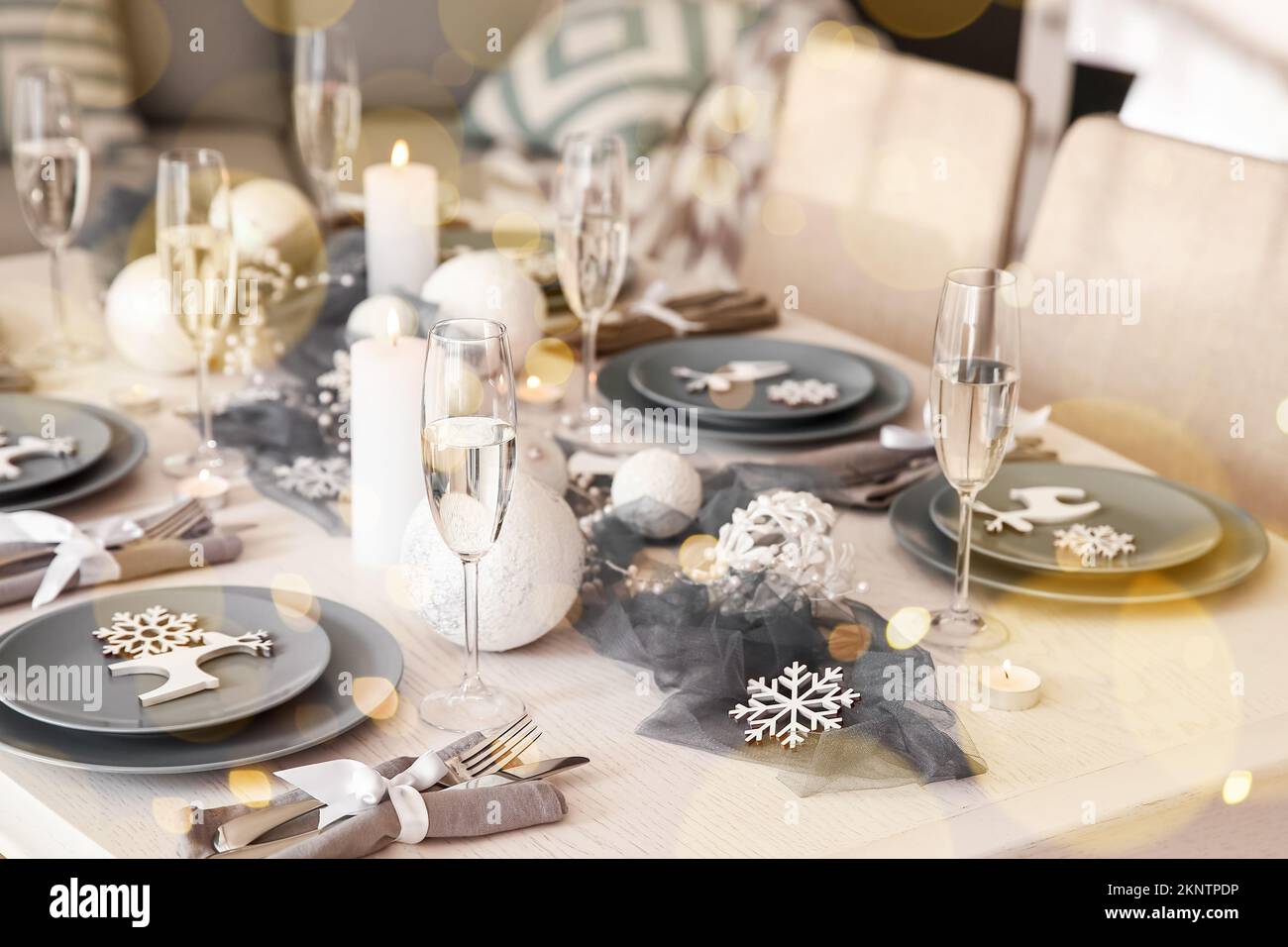 Magic table setting for Christmas dinner at home Stock Photo - Alamy