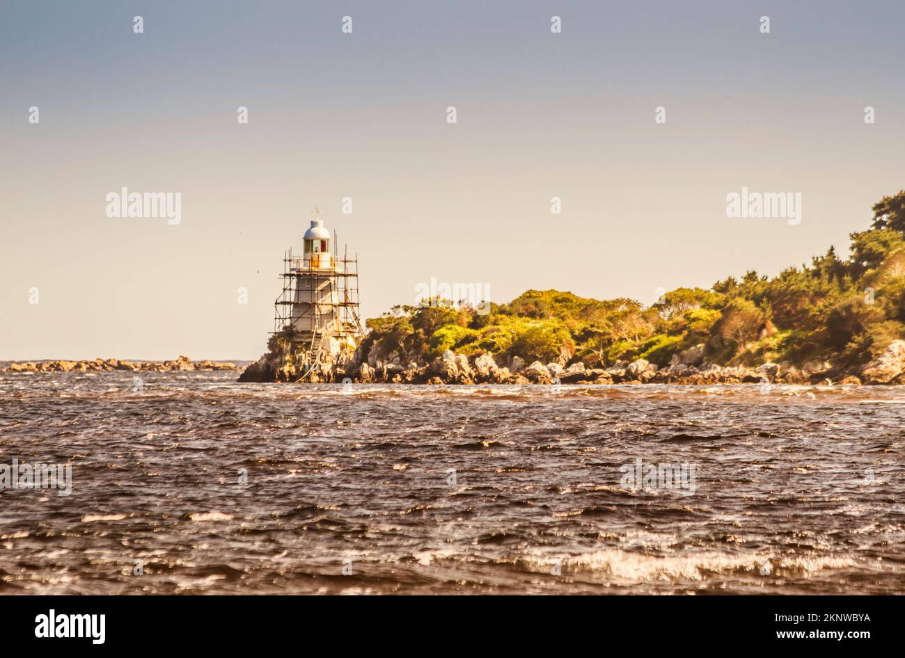 Scenic seashore structure in maritime reconstruction with a lighthouse