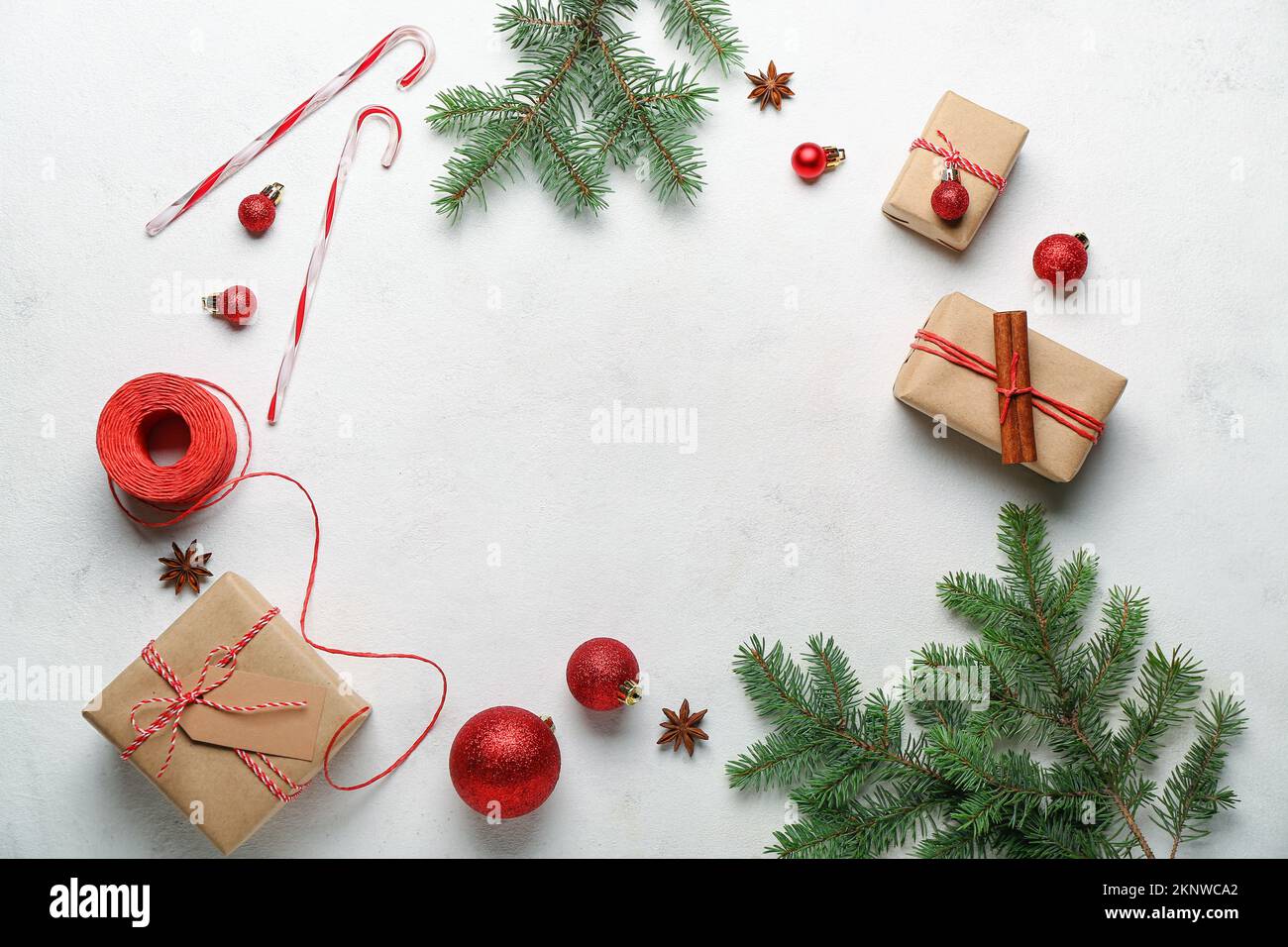 Frame made of Christmas gifts, decorations and fir branches on light ...