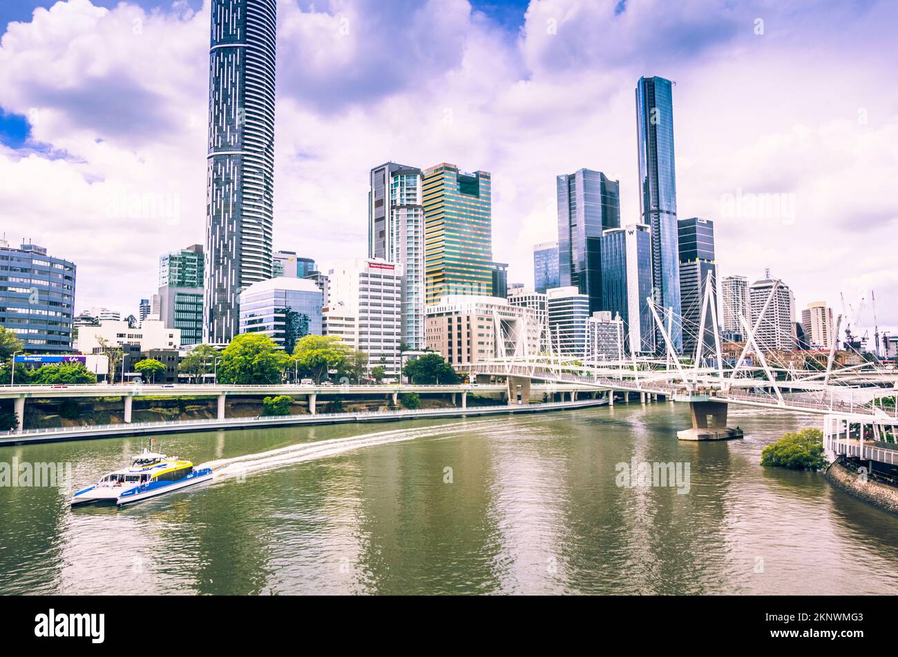 Scene of a peaceful cityscape complete with passenger ferry alongside a modern building expanse. Taken: Brisbane City, Queensland, Australia Stock Photo