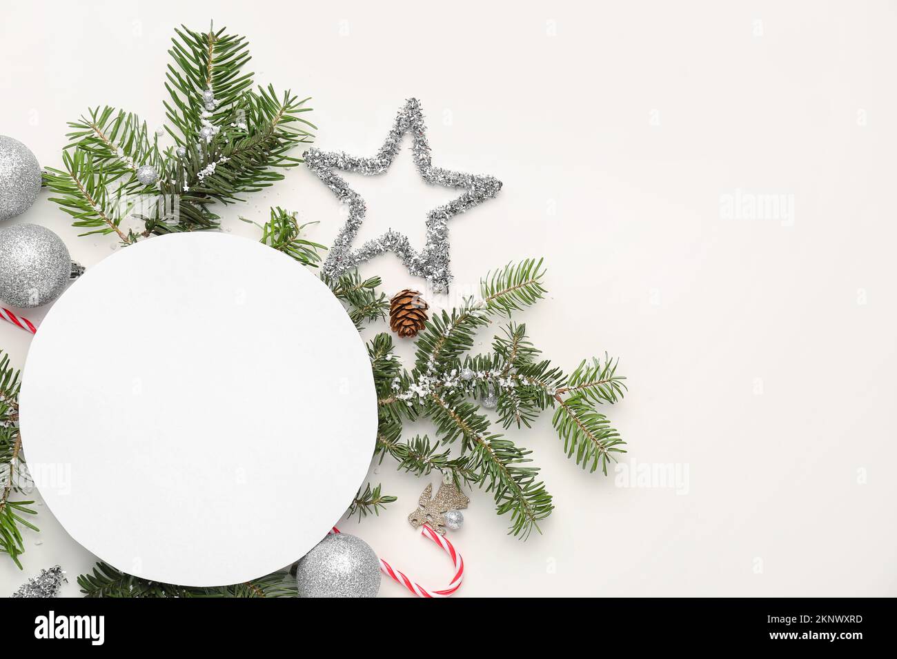Composition with blank card, fir branches and Christmas decorations on ...