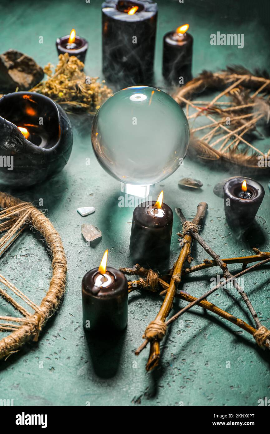 Magic attributes of fortune teller on green table Stock Photo - Alamy