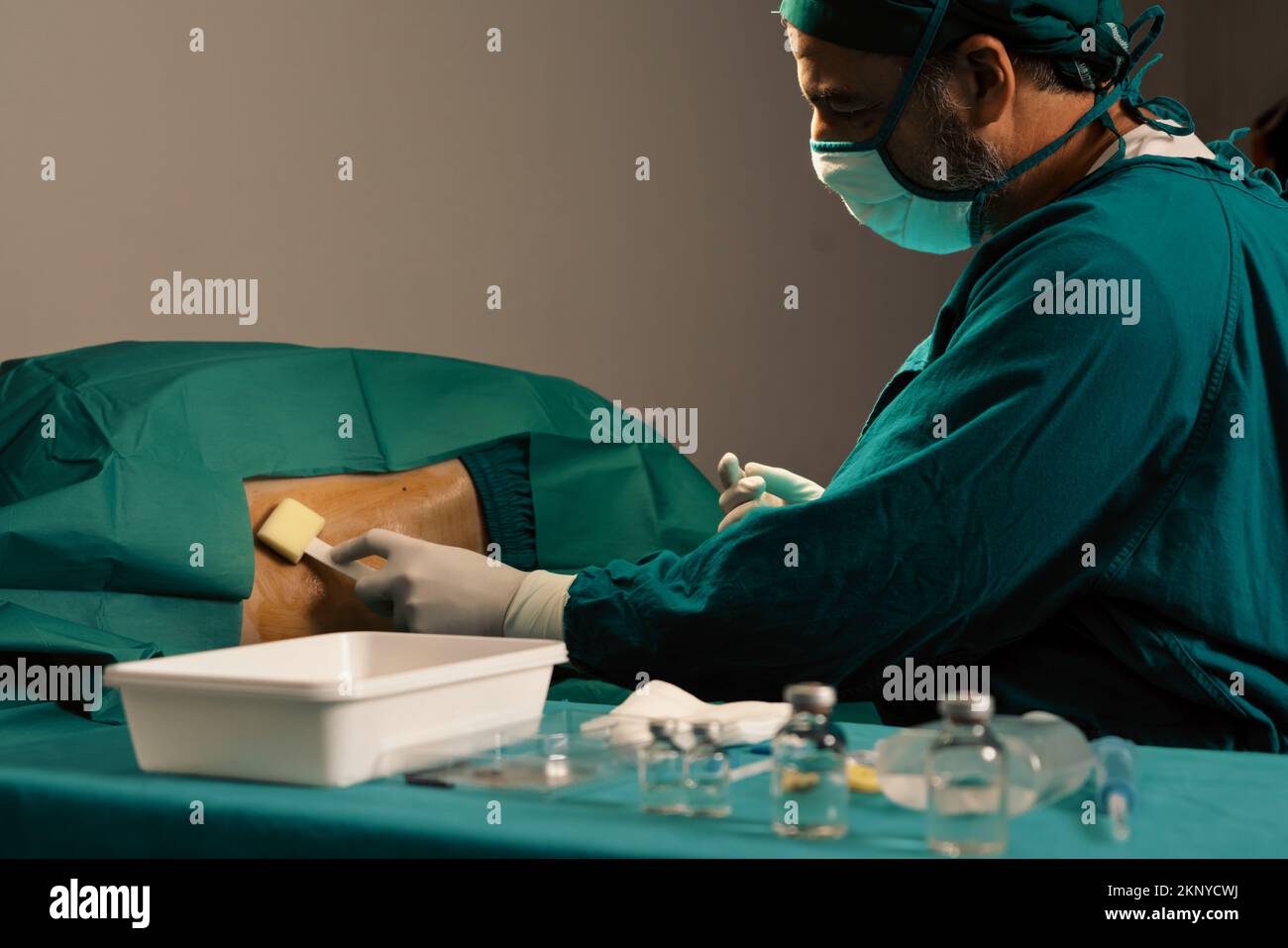 Doctor or surgeon apply betadine to the patient for anesthesia