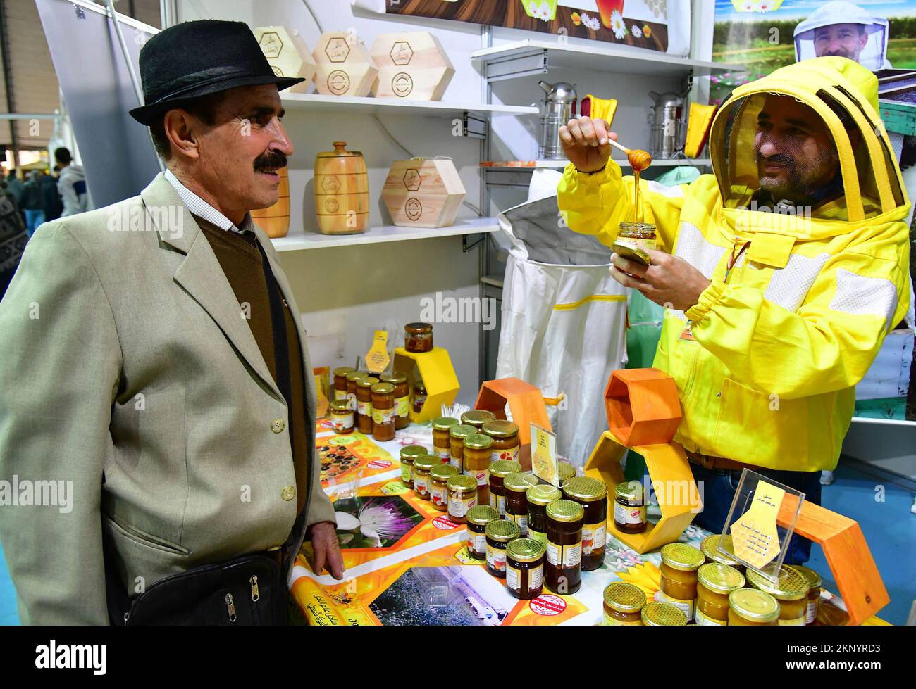 Damascus, Syria. 27th Nov, 2022. A man visits a honey festival in Damascus, Syria, Nov. 27, 2022. Honey of over 40 brands were displayed at the event. Credit: Ammar Safarjalani/Xinhua/Alamy Live News Stock Photo