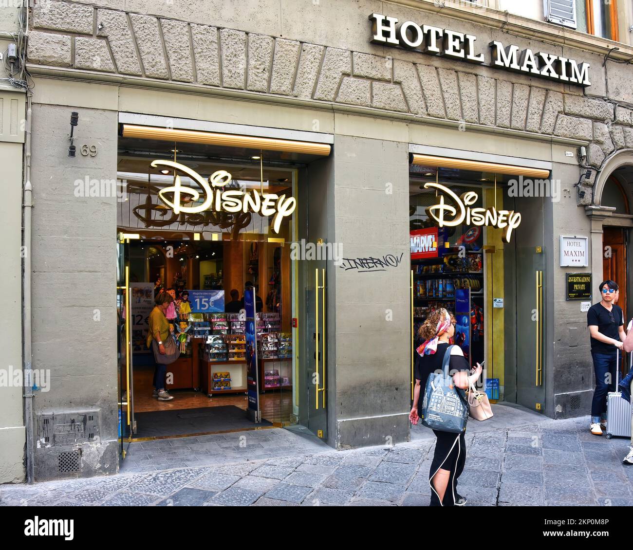 Florence, Italy - May 10, 2018: Disney Store in bottom floor of Maxim Hotel in busy shopping district. Stock Photo