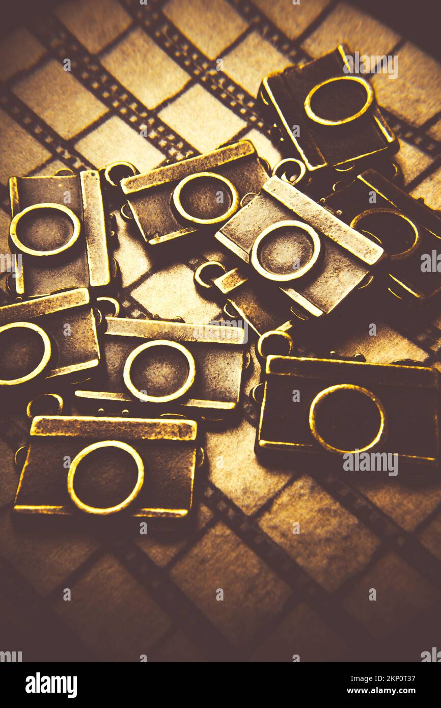 Artistic still life scene on a heap of pendant cameras laying in the
