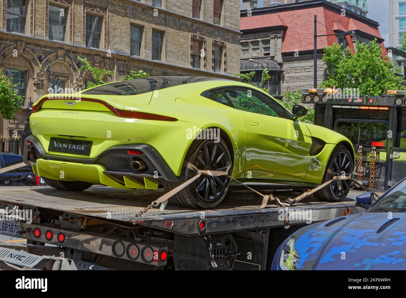 Astin Martin Vantage on the back of a flatbed tow truck. Montreal