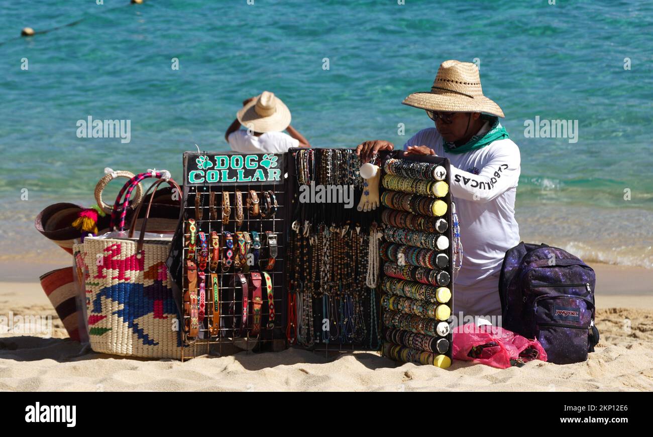 Cabo San Lucas, Mexico November 7, 2022 A local salesperson offering colorful souvenirs for