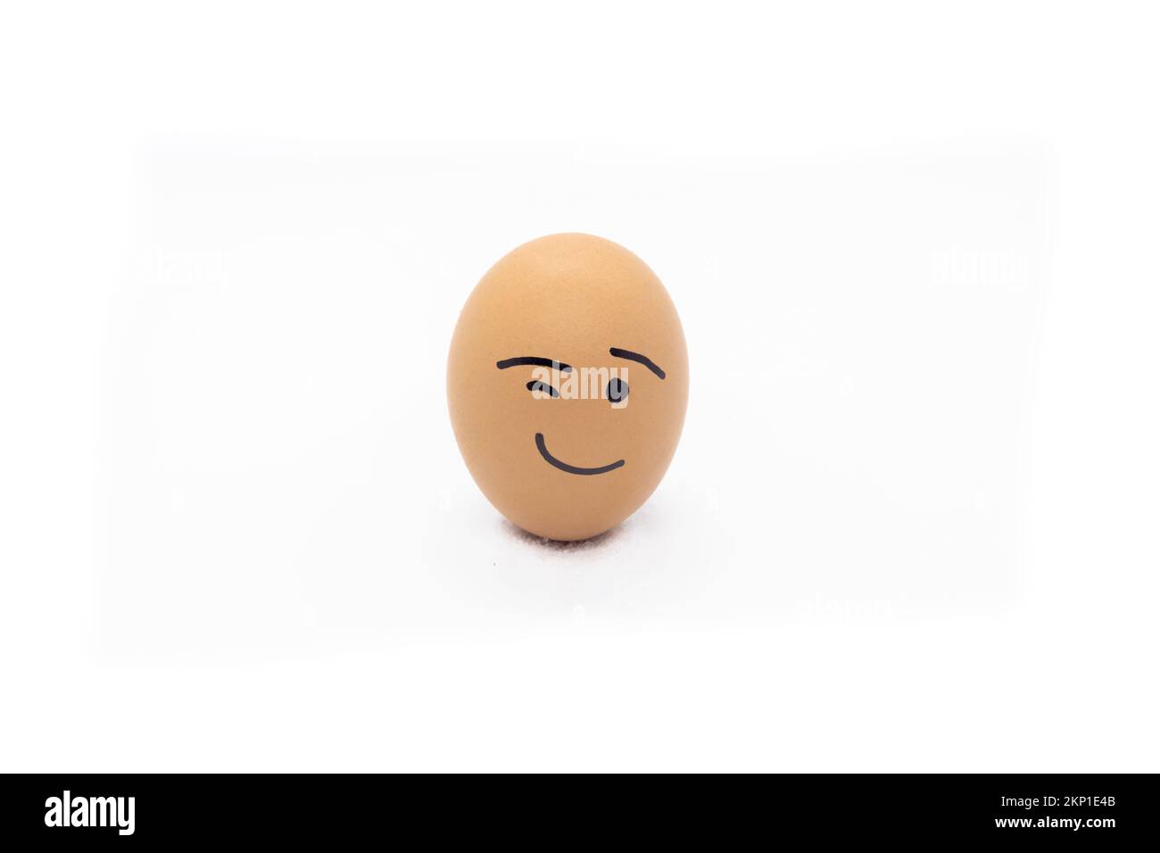 An egg winking in White background Stock Photo