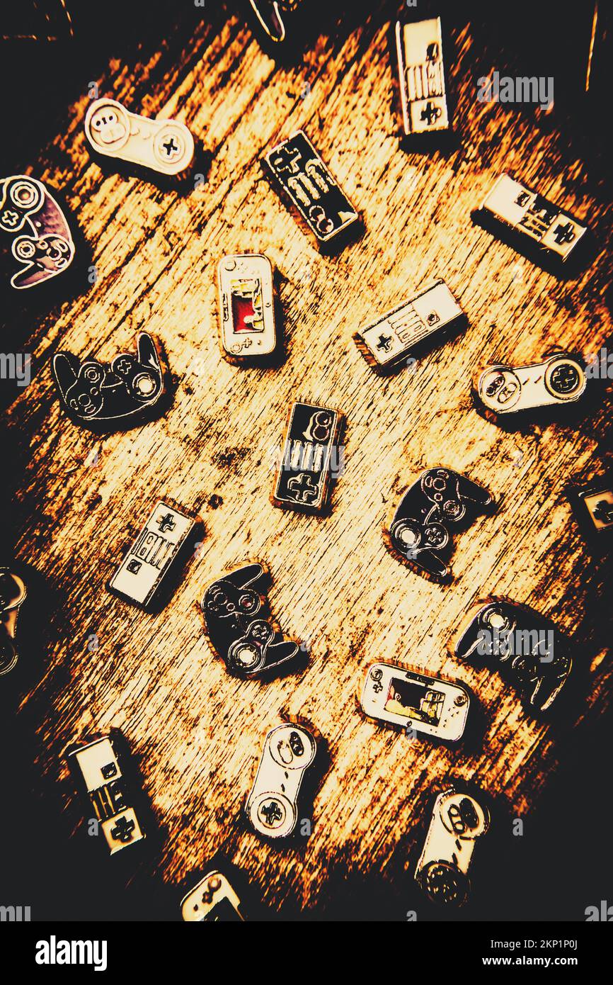 Vintage still life artwork on a heap of console gaming controllers in abstract form Stock Photo
