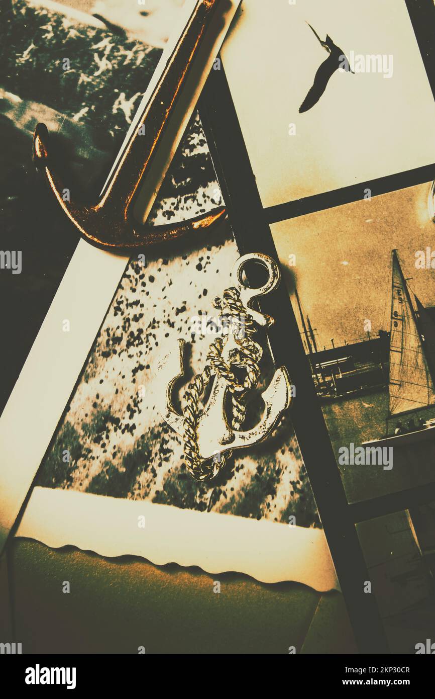 History in seafaring transport with a anchor amulet on rustic faded photographs from yesteryear Stock Photo