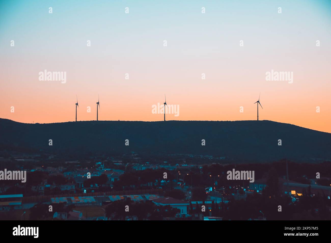 Wind turbine silhouettes at sunset Stock Photo - Alamy