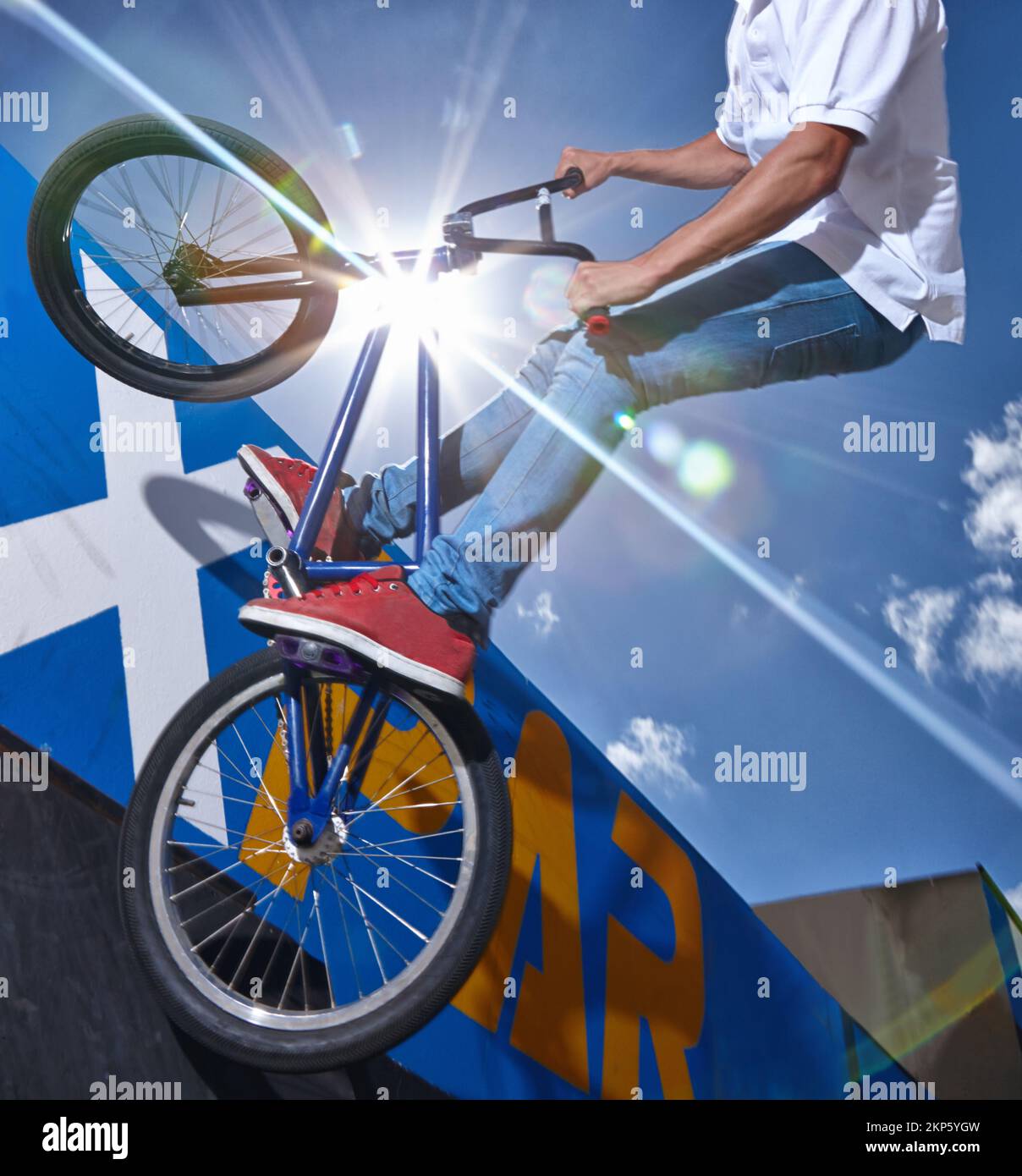 Practicing for the x games. a teenage boy riding a BMX at a skatepark