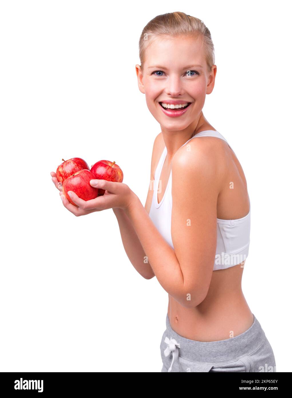 Three a day is better right. Portrait of a beautiful young woman holding apples in her hands. Stock Photo